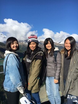 Group of four young students on a hiking trip 