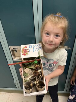 St. Teresa of Avila School pre-kindergarten student with her bug hotel